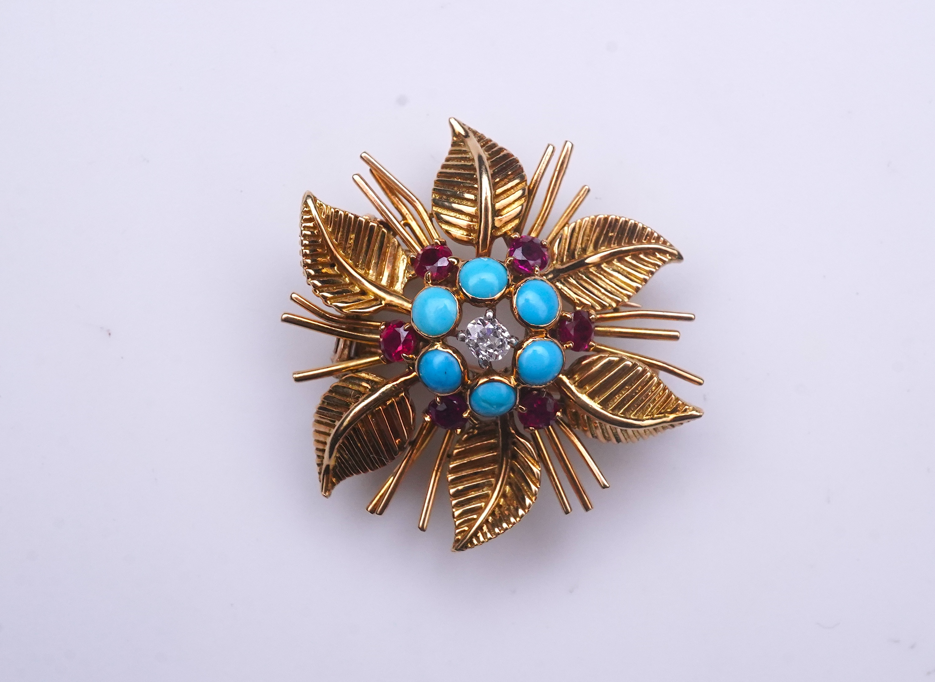 Chaumet, a turquoise, ruby and diamond brooch, mid 20th century